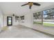 Bright living room featuring large windows with wooded view at 4400 Helena Ne St, St Petersburg, FL 33703