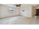 Bright living room with large window and modern ceiling fan at 4400 Helena Ne St, St Petersburg, FL 33703