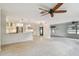 Open-concept living room with eat-in kitchen and natural light at 4400 Helena Ne St, St Petersburg, FL 33703