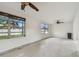 Spacious living room with fan and bright windows at 4400 Helena Ne St, St Petersburg, FL 33703