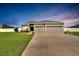Charming single-Gathering home with a well-manicured lawn and a two-car garage at 4435 Devinshire Fields Loop, Plant City, FL 33567