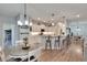 Modern kitchen featuring sleek countertops, pendant lighting, and bar stool seating at 4435 Devinshire Fields Loop, Plant City, FL 33567