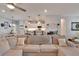 Comfortable seating area flows into a bright and open kitchen space at 4435 Devinshire Fields Loop, Plant City, FL 33567