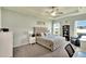 Serene main bedroom with a tray ceiling, plush carpeting, and ample natural light at 4435 Devinshire Fields Loop, Plant City, FL 33567