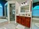 Modern bathroom featuring dual sinks, a walk-in shower, and a separate soaking tub at 4808 Jewell Ter, Palm Harbor, FL 34685
