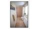 Cozy bathroom features a tiled shower, a well-lit vanity, and modern fixtures at 4808 Jewell Ter, Palm Harbor, FL 34685