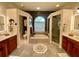 Spacious bathroom featuring dual vanities, a large soaking tub, and a separate shower at 4808 Jewell Ter, Palm Harbor, FL 34685