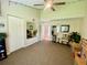 Bedroom featuring a vaulted ceiling with fan and connecting doorway to bathroom at 4808 Jewell Ter, Palm Harbor, FL 34685
