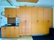 Functional garage with custom cabinets for storage and organization at 4808 Jewell Ter, Palm Harbor, FL 34685
