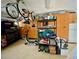 Well-organized garage with hanging bikes, shelving, and storage cabinets at 4808 Jewell Ter, Palm Harbor, FL 34685