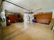 Organized garage with epoxy floor, storage cabinets, and ample space for vehicles and storage at 4808 Jewell Ter, Palm Harbor, FL 34685