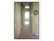 Hallway featuring neutral color palate, and access to the full bathroom at 4808 Jewell Ter, Palm Harbor, FL 34685