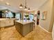 Spacious kitchen island and breakfast bar that flow seamlessly into the living and dining areas at 4808 Jewell Ter, Palm Harbor, FL 34685