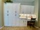 White kitchen featuring ample cabinet space, under cabinet lighting, and an integrated work station at 4808 Jewell Ter, Palm Harbor, FL 34685