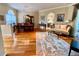 Bright living room featuring hardwood floors, neutral decor, and views to other rooms at 4808 Jewell Ter, Palm Harbor, FL 34685