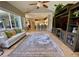 Spacious living room with a view of the kitchen and access to the backyard area at 4808 Jewell Ter, Palm Harbor, FL 34685