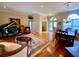 Open-concept living area featuring a piano, dining space, and access to other rooms at 4808 Jewell Ter, Palm Harbor, FL 34685