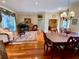 Well-appointed living space with a grand piano, dining area, and access to a library at 4808 Jewell Ter, Palm Harbor, FL 34685