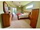 Cozy main bedroom with a ceiling fan, sliding glass door and views of the pool at 4808 Jewell Ter, Palm Harbor, FL 34685