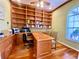 Home office with custom wooden built-ins, ample desk space, and natural light at 4808 Jewell Ter, Palm Harbor, FL 34685