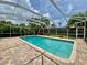 A beautiful screened-in pool area with brick patio, perfect for outdoor entertaining at 4808 Jewell Ter, Palm Harbor, FL 34685