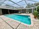 A beautiful screened-in pool area with brick patio, perfect for outdoor entertaining at 4808 Jewell Ter, Palm Harbor, FL 34685