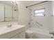 Functional bathroom with a combination shower and tub, single sink vanity, and ample storage at 4842 Odyssey Ave, Holiday, FL 34690