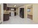 Open kitchen with stainless steel appliances, tile flooring, and ample cabinet space at 4842 Odyssey Ave, Holiday, FL 34690