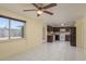 This kitchen boasts granite counters and includes stainless-steel appliances and tile flooring at 4842 Odyssey Ave, Holiday, FL 34690