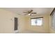 Bright living space with tiled flooring, a window, and a rear entry door at 4842 Odyssey Ave, Holiday, FL 34690