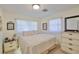 Serene bedroom featuring neutral tones, soft lighting, and two closets for ample storage at 513 Fairhope Dr, Apollo Beach, FL 33572