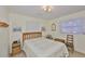 Bedroom featuring a queen bed, natural hardwood furniture, and natural light at 513 Fairhope Dr, Apollo Beach, FL 33572