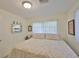 Comfortable bedroom featuring a queen bed, neutral tones, and ample natural light at 513 Fairhope Dr, Apollo Beach, FL 33572