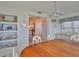 Elegant dining area with chandelier, large windows, and a built-in hutch for stylish storage at 513 Fairhope Dr, Apollo Beach, FL 33572