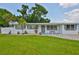 Charming single story home featuring a well-manicured lawn and a painted brick facade at 513 Fairhope Dr, Apollo Beach, FL 33572
