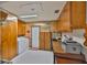 Spacious laundry room with tile floors, washer, dryer, storage and utility sink at 513 Fairhope Dr, Apollo Beach, FL 33572