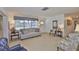 Inviting living room with neutral carpet, plenty of natural light, and comfortable seating arrangements at 513 Fairhope Dr, Apollo Beach, FL 33572