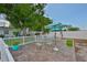 Outdoor patio featuring a table, chairs, and umbrellas, perfect for relaxing and entertaining in a private setting at 513 Fairhope Dr, Apollo Beach, FL 33572