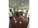 Spacious common room with hardwood floors, tables and chairs for community use at 5220 Brittany S Dr # 1306, St Petersburg, FL 33715