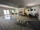 Large common room with a fireplace, comfortable seating, and stylish decor at 5220 Brittany S Dr # 1306, St Petersburg, FL 33715