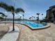 Sparkling community pool with views of the water and a tropical setting at 5220 Brittany S Dr # 1306, St Petersburg, FL 33715