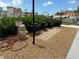 Community grilling area with multiple gas grills and well-maintained landscaping at 5220 Brittany S Dr # 1306, St Petersburg, FL 33715