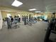 Gym featuring modern cardio and weight-training equipment, mirrored walls, and bright lighting at 5220 Brittany S Dr # 1306, St Petersburg, FL 33715