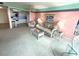 Bright living room with white wicker furniture, comfortable seating and connecting kitchen at 5220 Brittany S Dr # 1306, St Petersburg, FL 33715