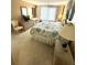 Comfortable bedroom featuring neutral walls, light carpet, and bright windows with natural light at 5220 Brittany S Dr # 1306, St Petersburg, FL 33715