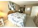Bright primary bedroom with a large bed, serene decor and neutral-toned walls with closet entrance at 5220 Brittany S Dr # 1306, St Petersburg, FL 33715
