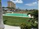 Community shuffleboard court on beautifully landscaped grounds with mature palm trees at 5220 Brittany S Dr # 1306, St Petersburg, FL 33715