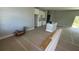 Spacious living room featuring neutral walls and a view into the kitchen area at 5229 Chaney Ter, Port Charlotte, FL 33981