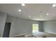 Bright living room with recessed lighting, sliding glass doors and neutral paint at 5229 Chaney Ter, Port Charlotte, FL 33981