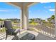 Relaxing outdoor balcony with seating and a view of the neighborhood, ideal for enjoying the fresh air at 5810 Fieldmoor Ct, Palmetto, FL 34221
